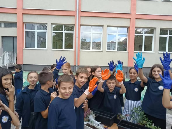 Students taking part in the flower planting activity